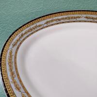 Vintage 14 Inch Oval Porcelain Serving Platter with Gold and Black Leaves Design